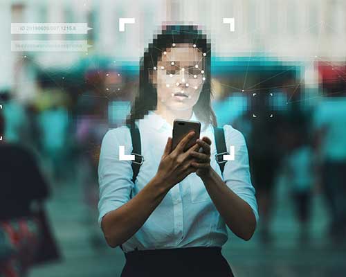 photo of a woman looking at a cellphone screen